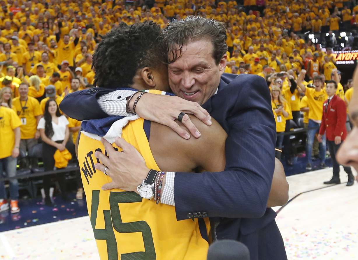 Quin Snyder hugs Donovan Mitchell following a playoff victory.