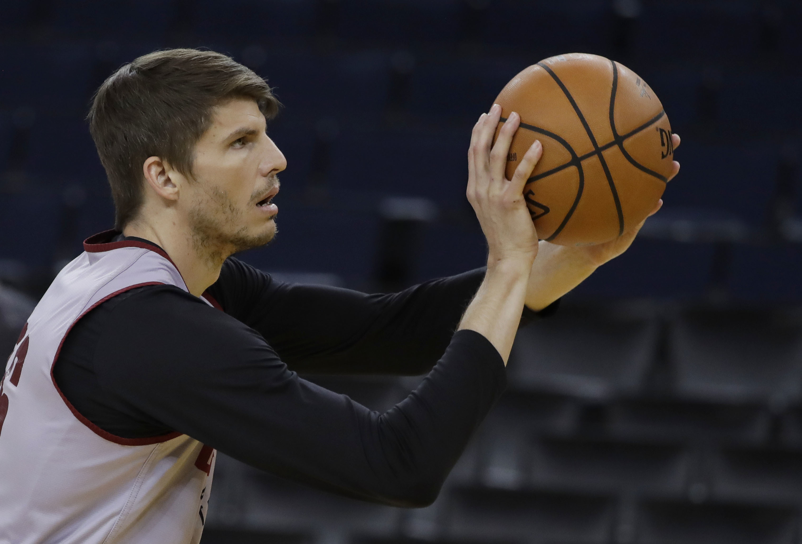 The Latest: Warriors top Cavs 124-114 in OT to open finals