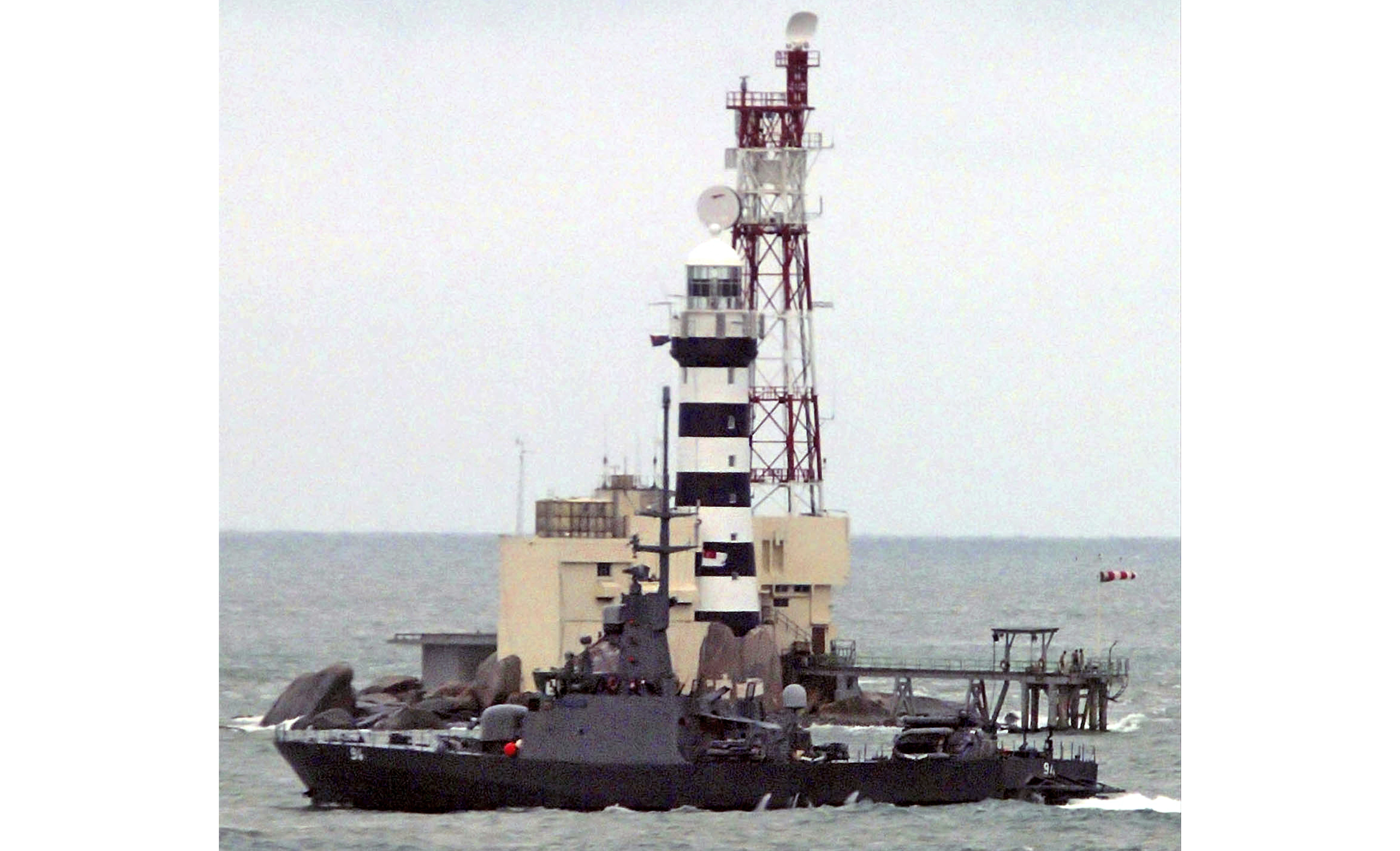 Malaysia drops request for review of island ownership ruling