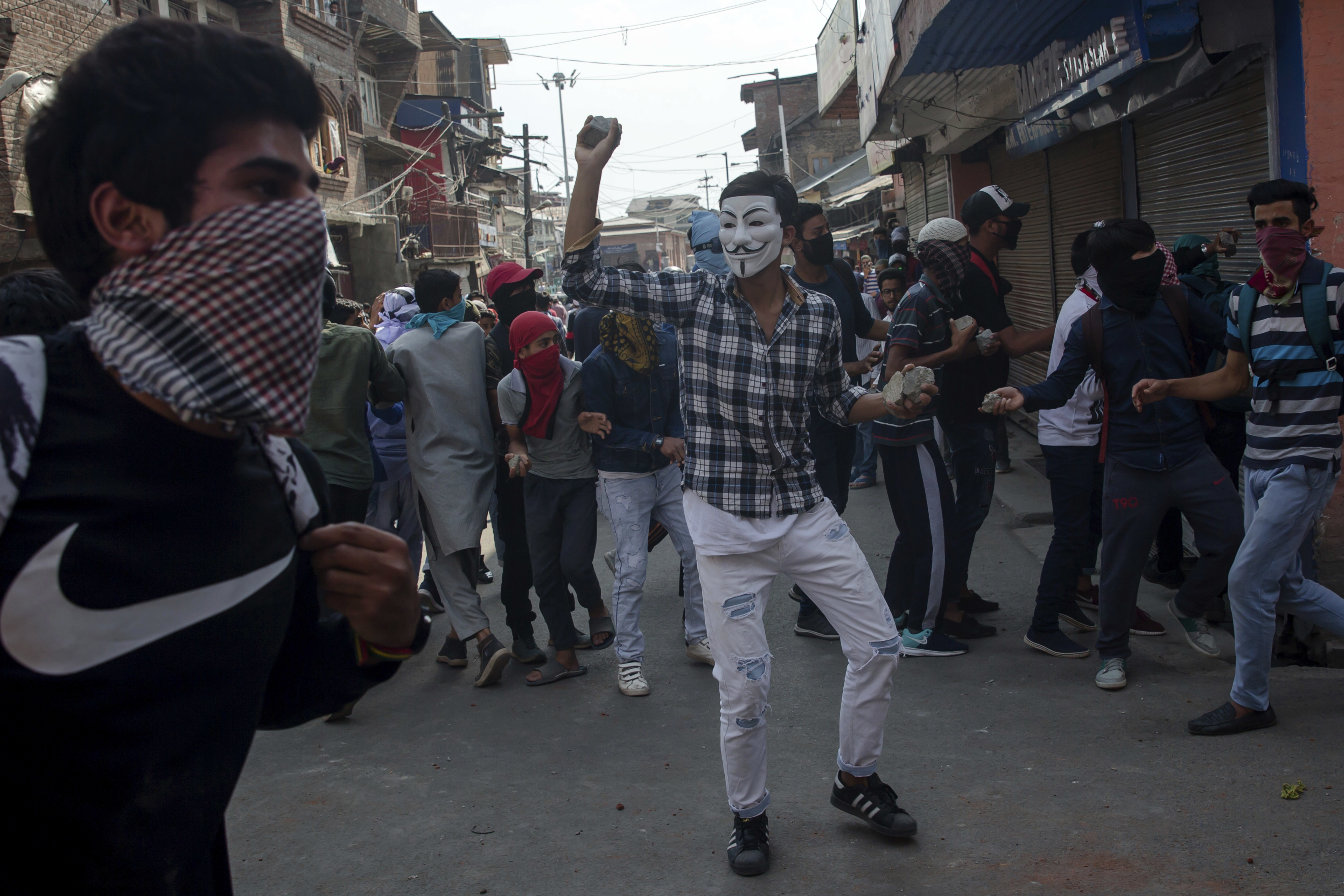 AP Photos: Kashmir man crushed by paramilitary force vehicle