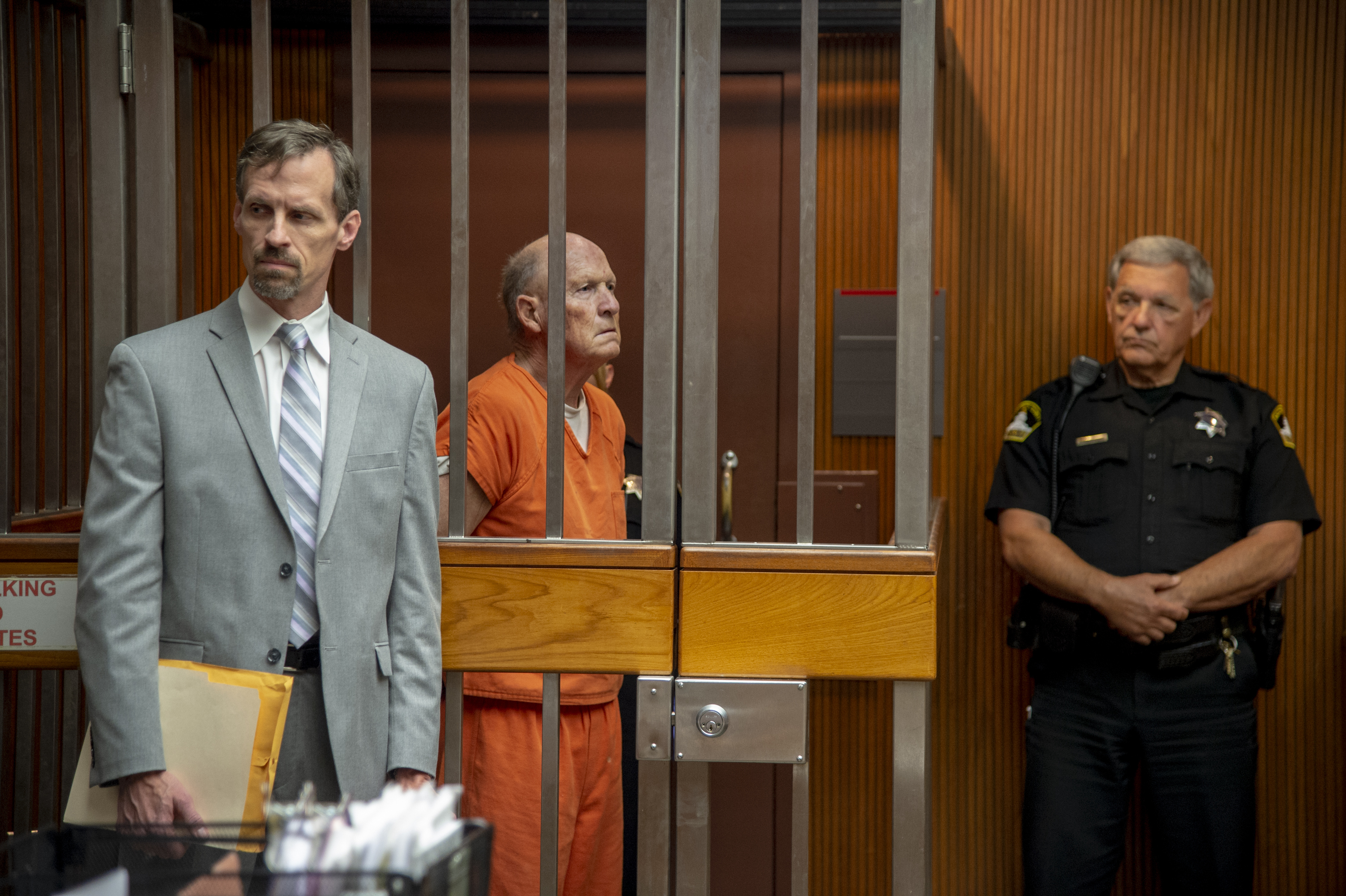 Defense attorney Joe Cress stands next to his client Joseph James DeAngelo appears in Sacramento Superior Court, Friday, June 1, 2018, in Sacramento, Calif. He is suspected in at least a dozen killings and roughly 50 rapes in the 1970s and '80s. (José Luis Villegas/The Sacramento Bee via AP, Pool)