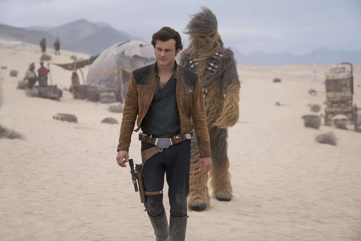 This undated file image released by Lucasfilm shows Alden Ehrenreich and Joonas Suotamo in a scene from "Solo: A Star Wars Story." In a box-office blip that echoed through the multiplexes, “Solo: A Star Wars Story” didn't fare well over the Memorial Day weekend, amassing an estimated $103 million in ticket sales from Thursday night to Monday, May 28, 2018. (Jonathan Olley, Lucasfilm via AP, File)