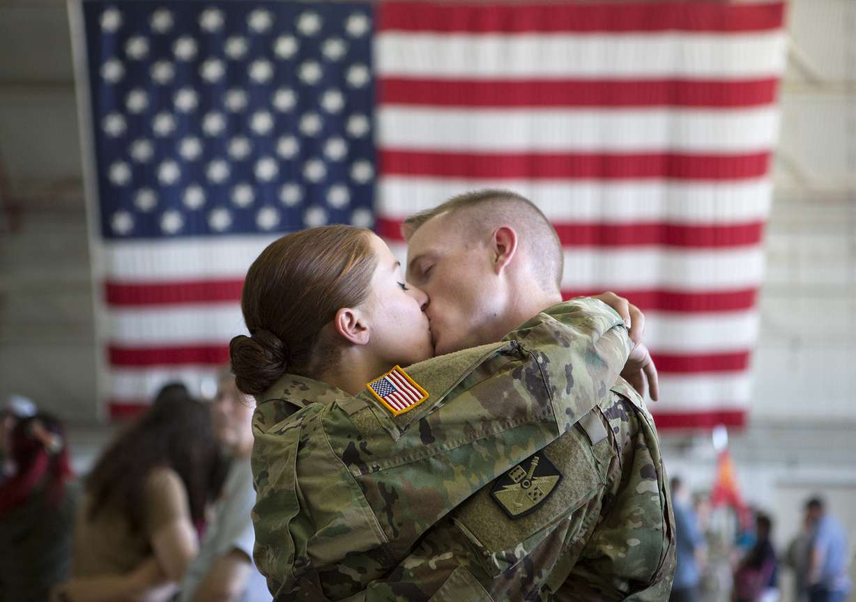 2nd Lt. Corinne Galland kisses her husband, 1st Lt. Colter Bowman, before his deployment to the Middle East with approximately 100 Utah National Guard soldiers at the Roland R. Wright Air National Guard Base in Salt Lake City on Monday, June 4, 2018. (Photo: James Wooldridge, KSL)