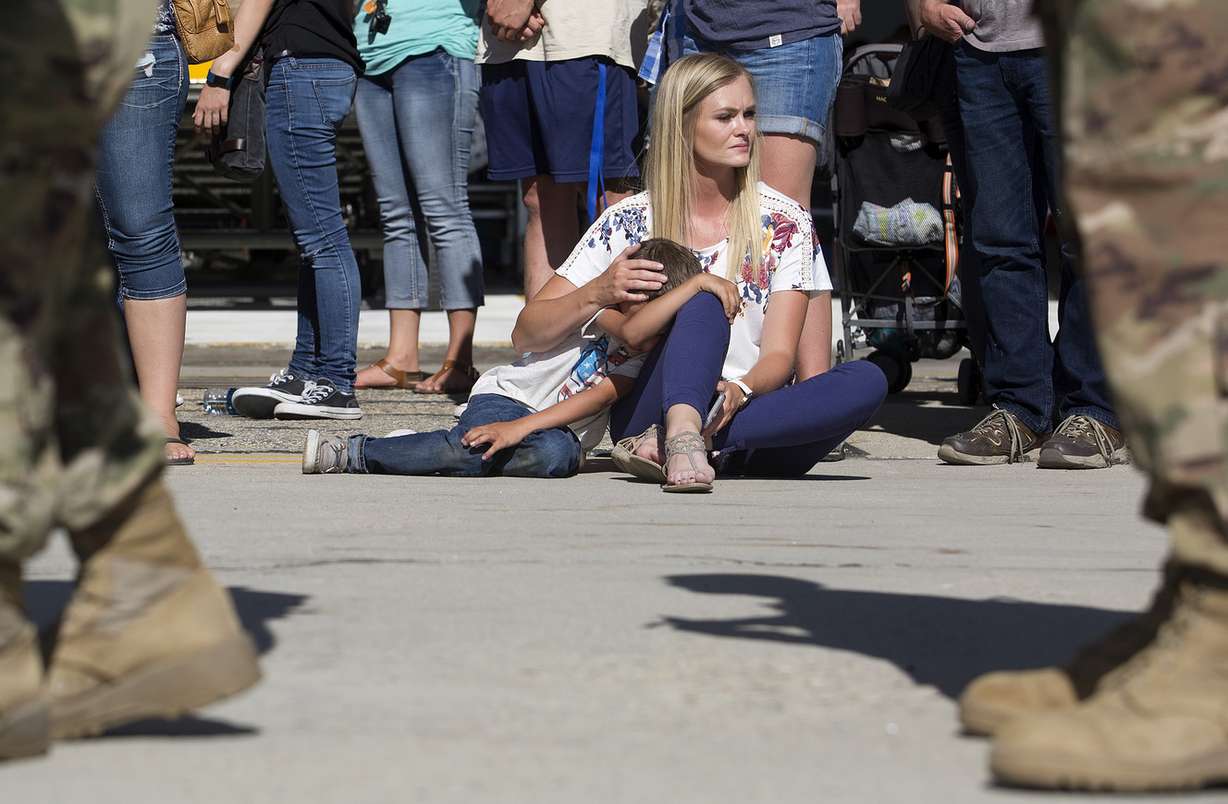 Rachel Hendrickson comforts her son, Carson Hendrickson, 6, as her husband, Staff Sgt. Eric Hendrickson of the Utah National Guard, is deployed to the Middle East at the Roland R. Wright Air National Guard Base in Salt Lake City on Monday, June 4, 2018. (Photo: James Wooldridge, KSL)