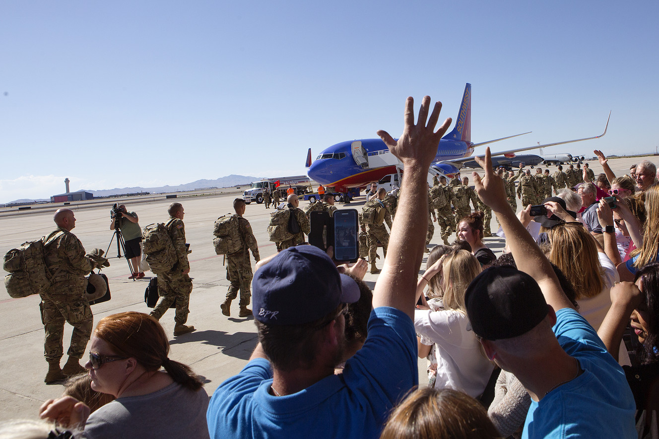 Friends and family wave goodbye to Utah National Guard soldiers being deployed to the Middle East at the Roland R. Wright Air National Guard Base in Salt Lake City on Monday, June 4, 2018. (Photo: James Wooldridge, KSL)