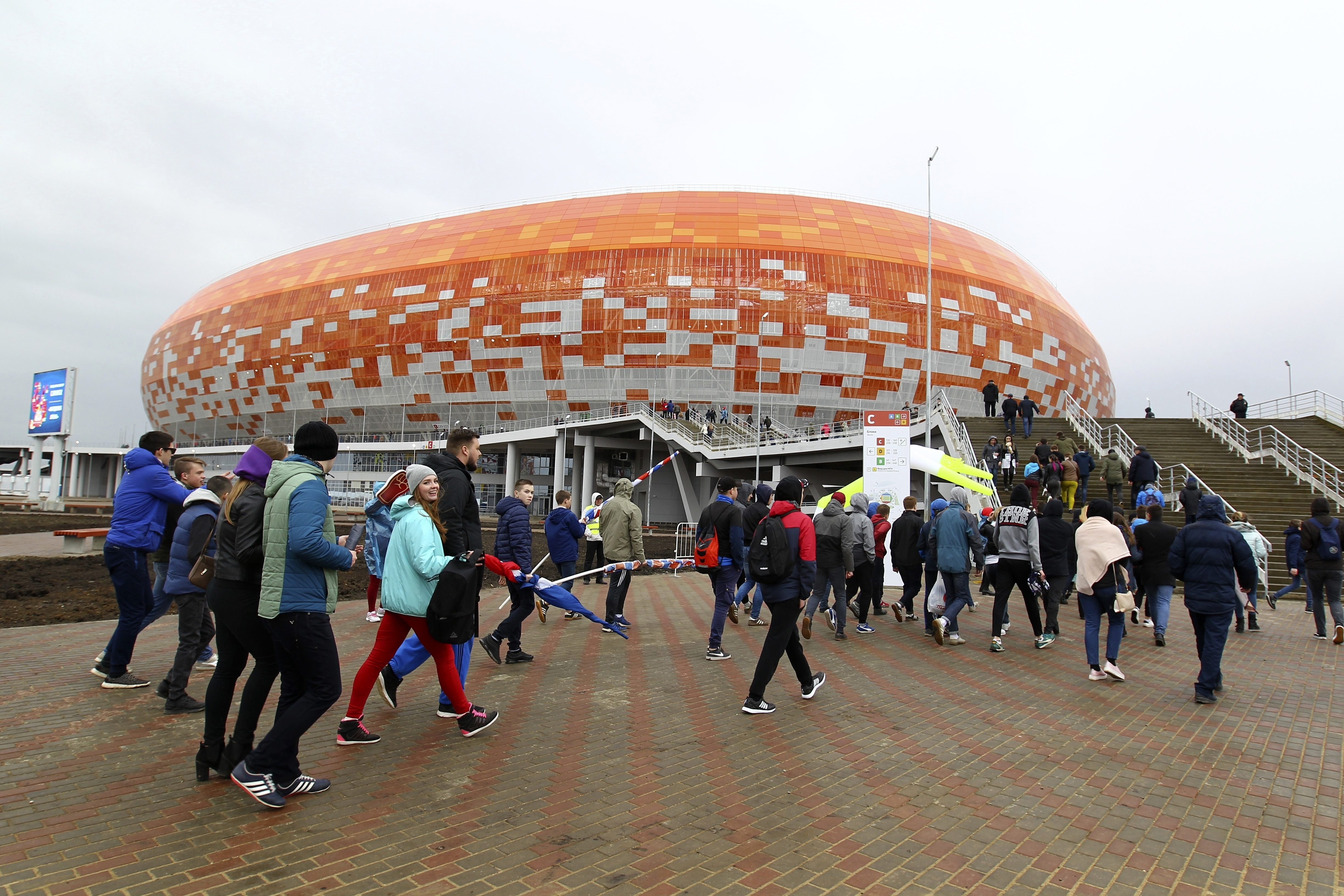 In this photo taken on Saturday, April 21, 2018 walk to the new World Cup stadium to watch the Russian second league soccer match between Mordovia and Zenit-Izhevsk in Saransk, Russia. (Julia Chestnova, AP Photo, File)