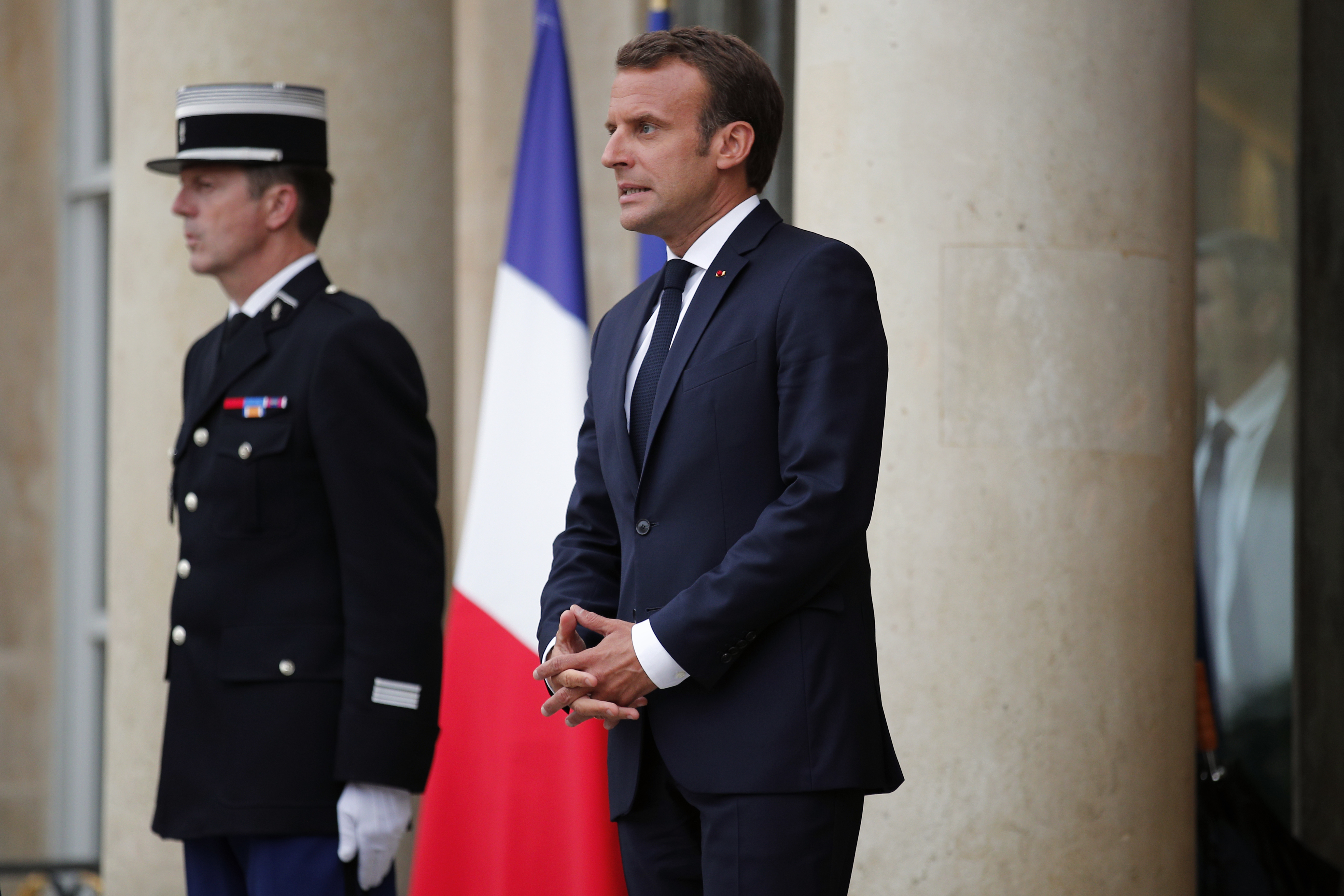 Macron uses laws and sausages to deflect Trump call question