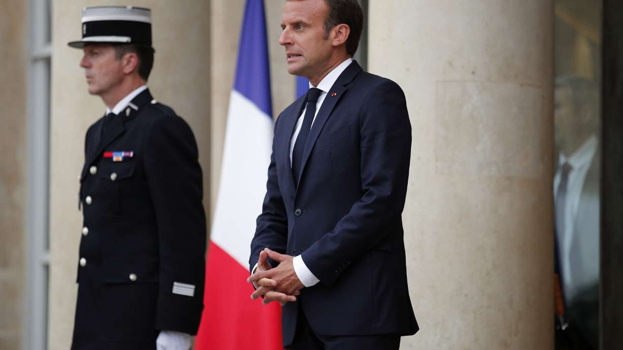 Macron uses laws and sausages to deflect Trump call question