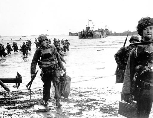 Carrying full equipment, American assault troops move onto a beachhead code-named Omaha Beach, on the northern coast of France on June 6, 1944, during the Allied invasion of the Normandy coast. (AP Photo)