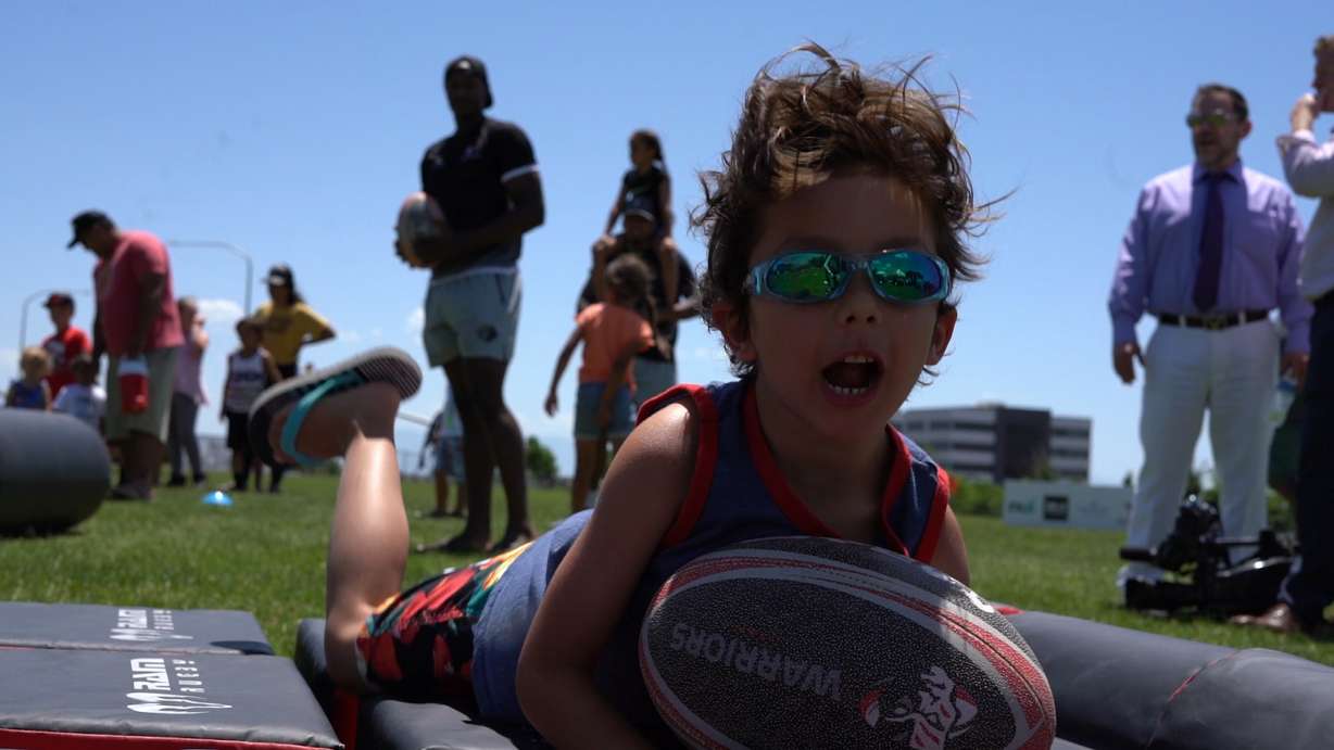 A young fan plays during the Utah Warriors' Pies and Tries fanfest, Wednesday, June 6, 2018 in Lehi. (Photo: McKay Pett, KSL TV)