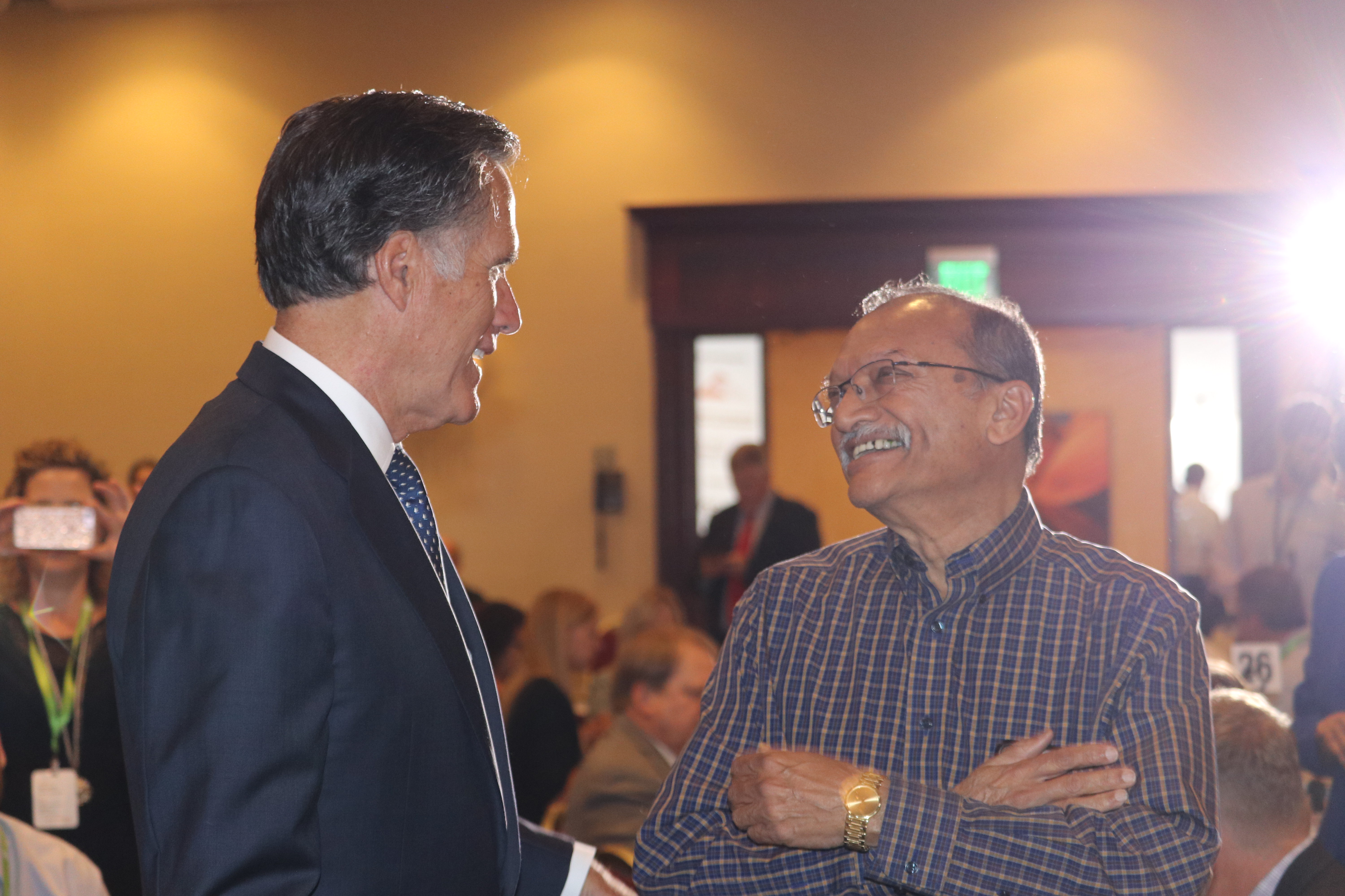 Mitt Romney talks to local business owner Dinesh Patel at Utah Technology Innovation Summit. (Photo: Liesl Nielsen, KSL.com)