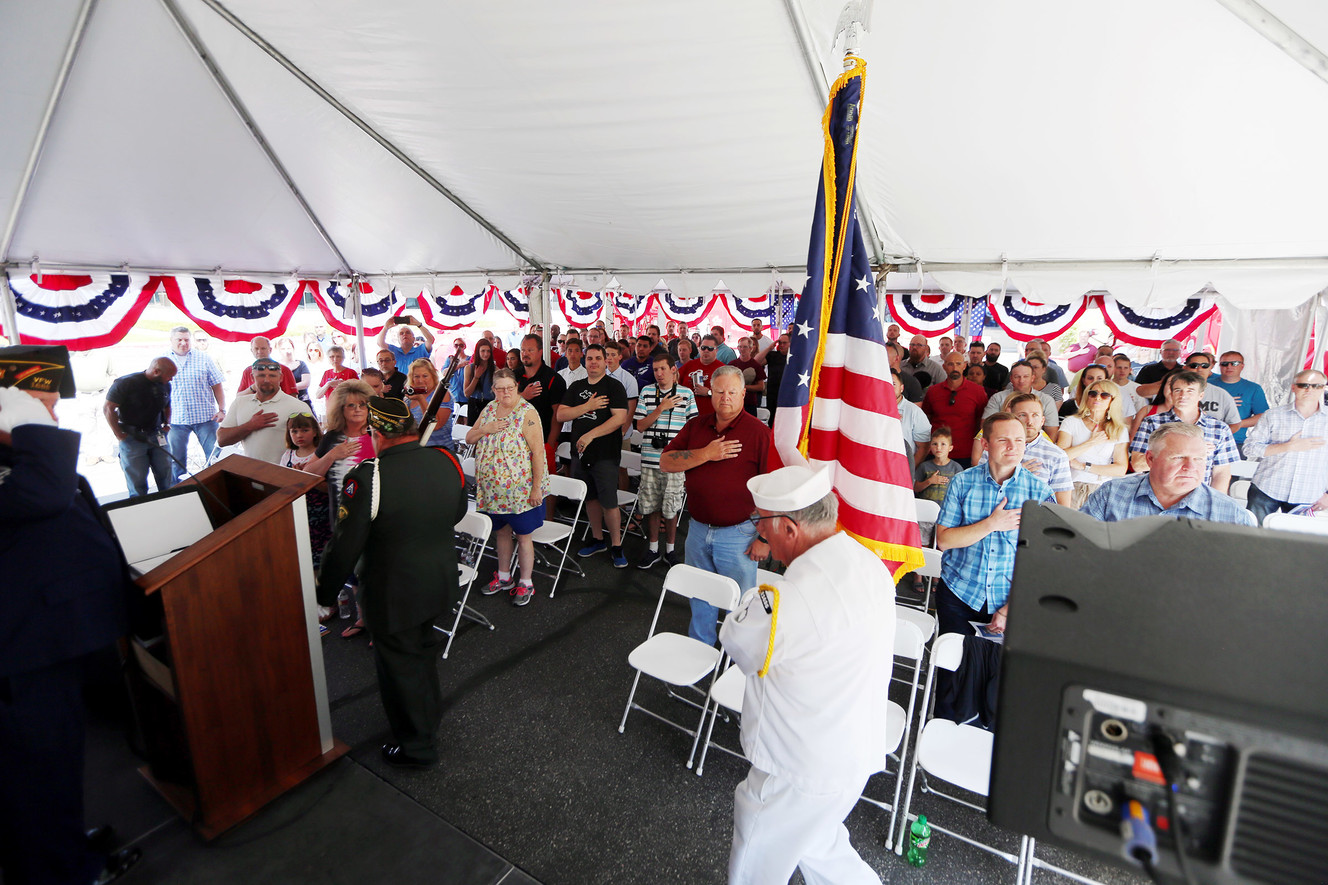 C.R. England Chairman Dan England welcomes drivers Corey Reed, Jeff Brooks, Arthur Martin and Anthony Holland to the company's Honored Veterans Fleet during a ceremony in West Valley City on Friday, June 8, 2018. (Photo: Scott G Winterton, KSL)