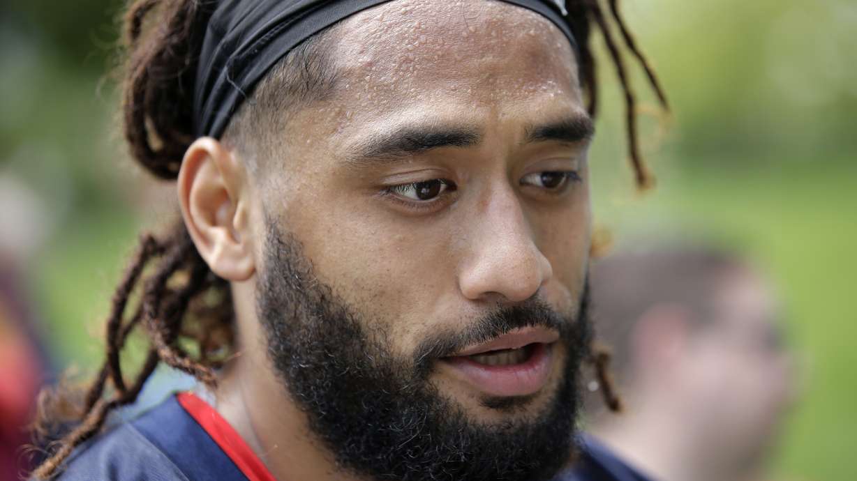 New England Patriots linebacker Harvey Langi takes questions from reporters following an NFL football minicamp practice, Thursday, June 7, 2018, in Foxborough, Mass. (AP Photo/Steven Senne)