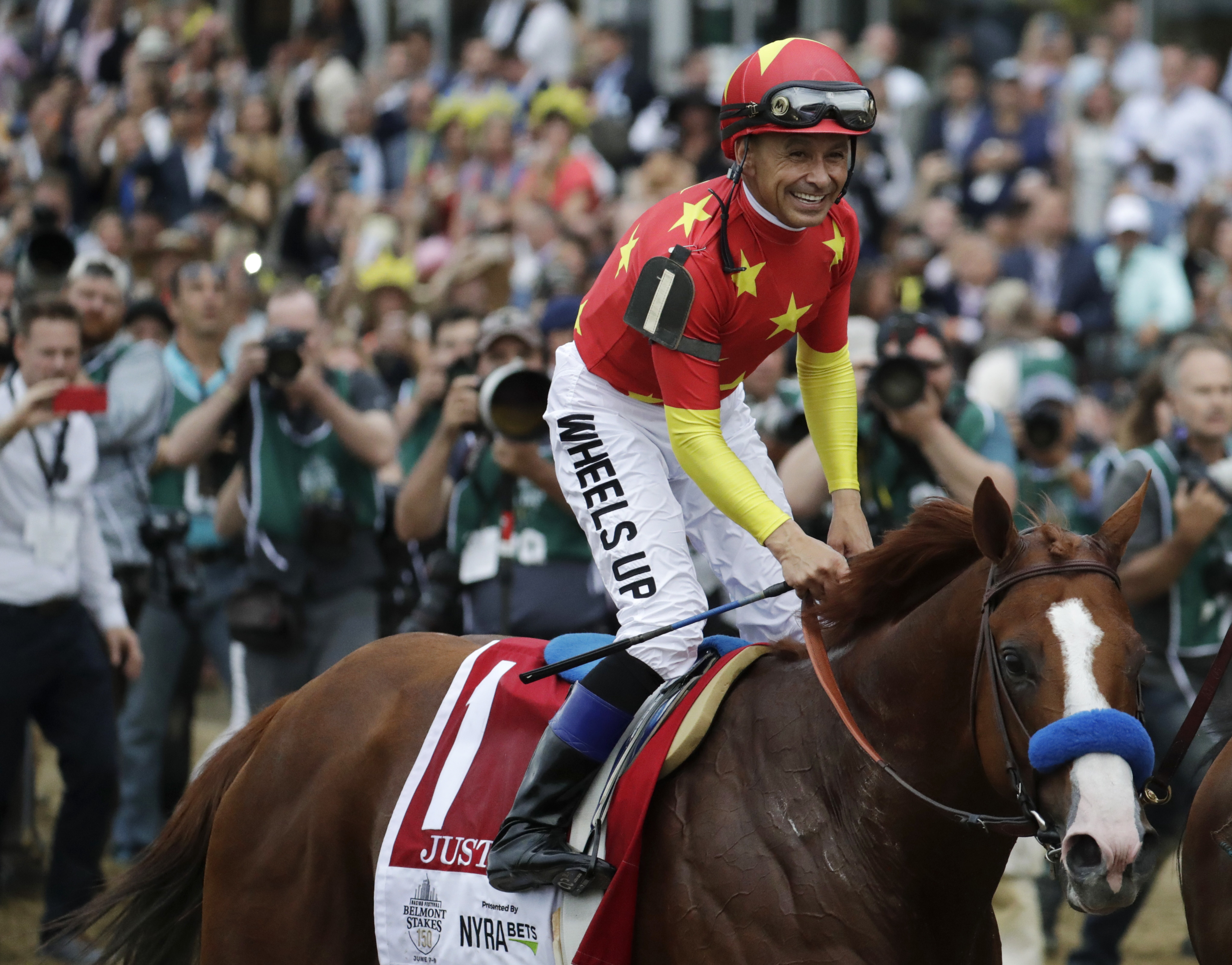 Mike Smith, 52, becomes oldest jockey to win Triple Crown