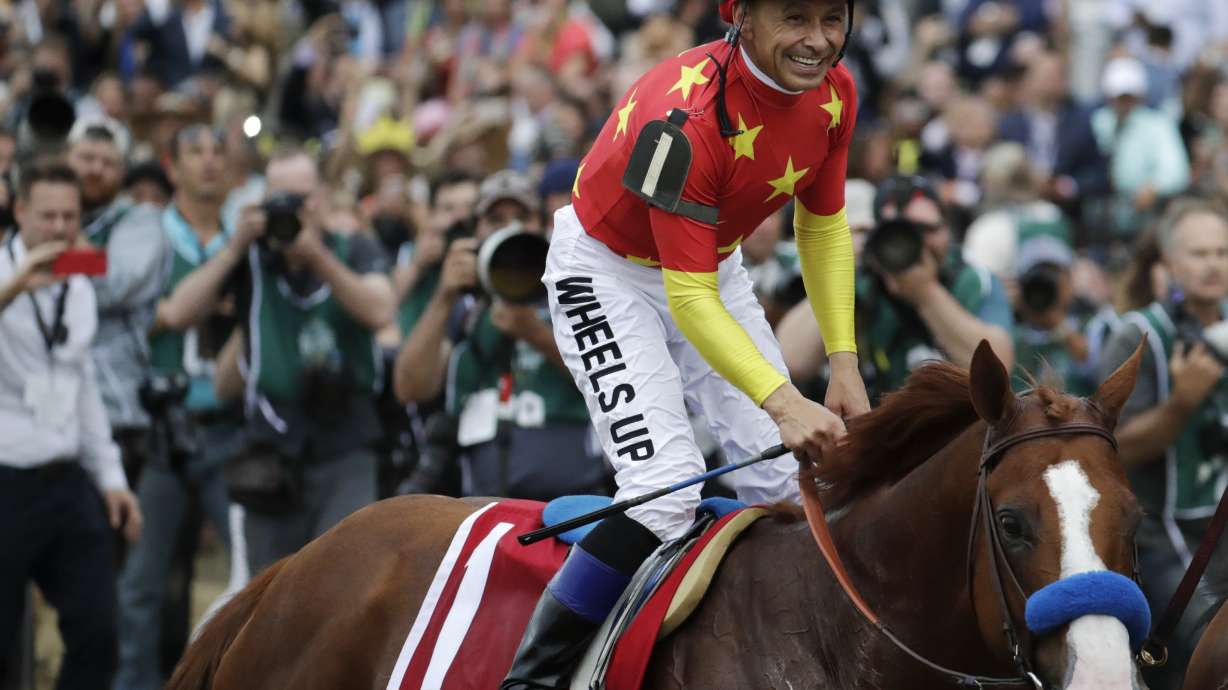 Mike Smith, 52, becomes oldest jockey to win Triple Crown