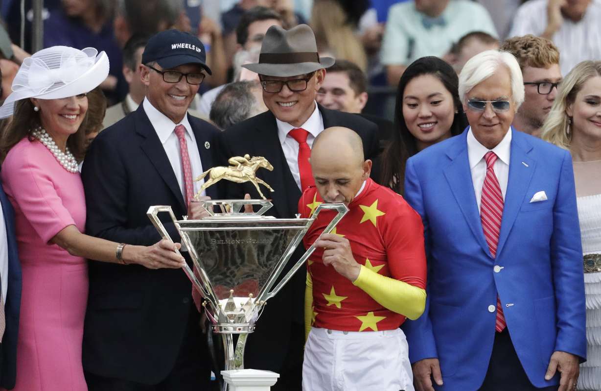 Jockey Mike Smith kisses the August Belmont trophy after winning the Triple Crown aboard Justify in the 150th running of the Belmont Stakes horse race Saturday, June 9, 2018, in Elmont, N.Y. (Photo: Julio Cortez, AP)
