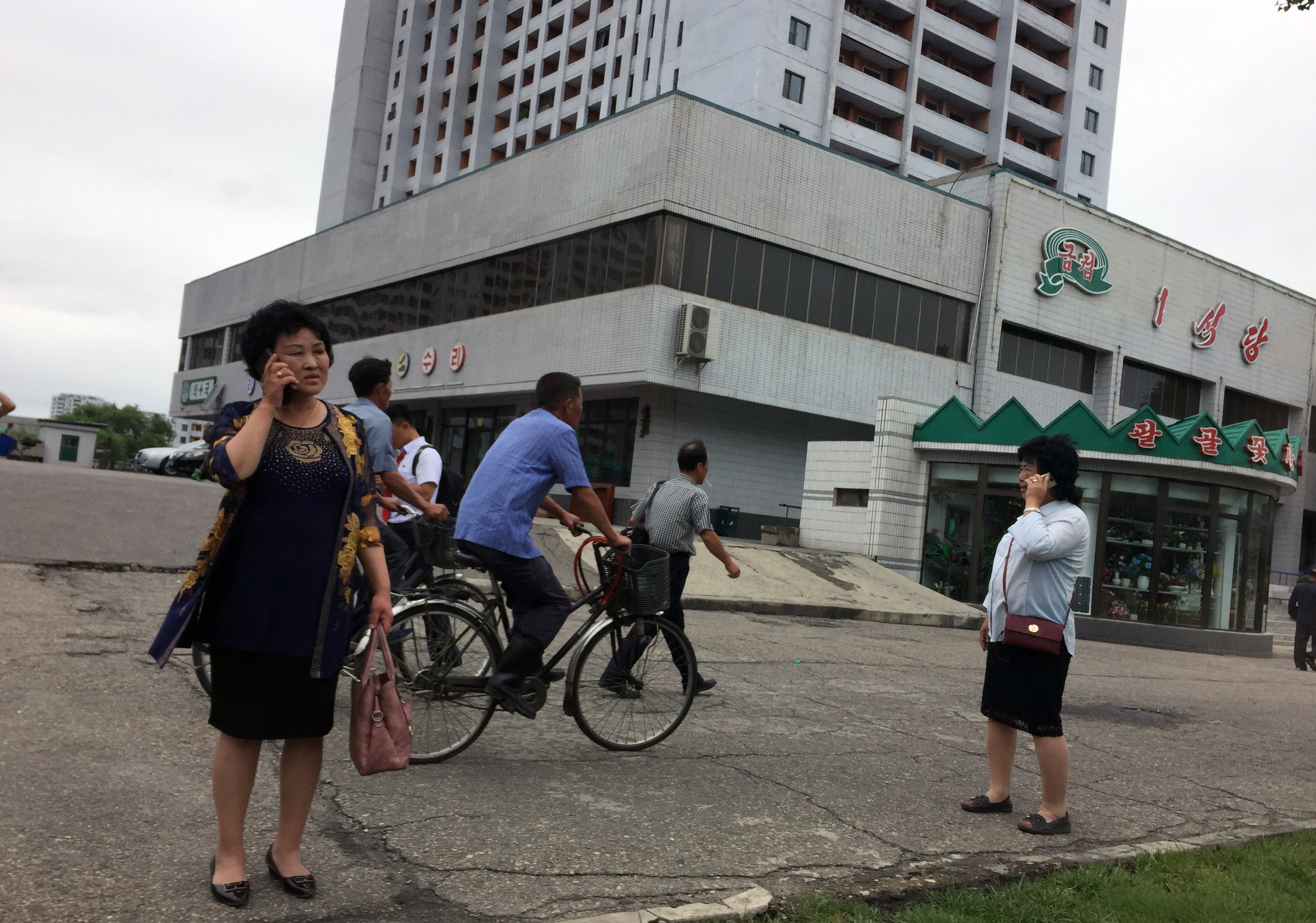 In eye of storm, North Koreans sees scant news of Kim's trip