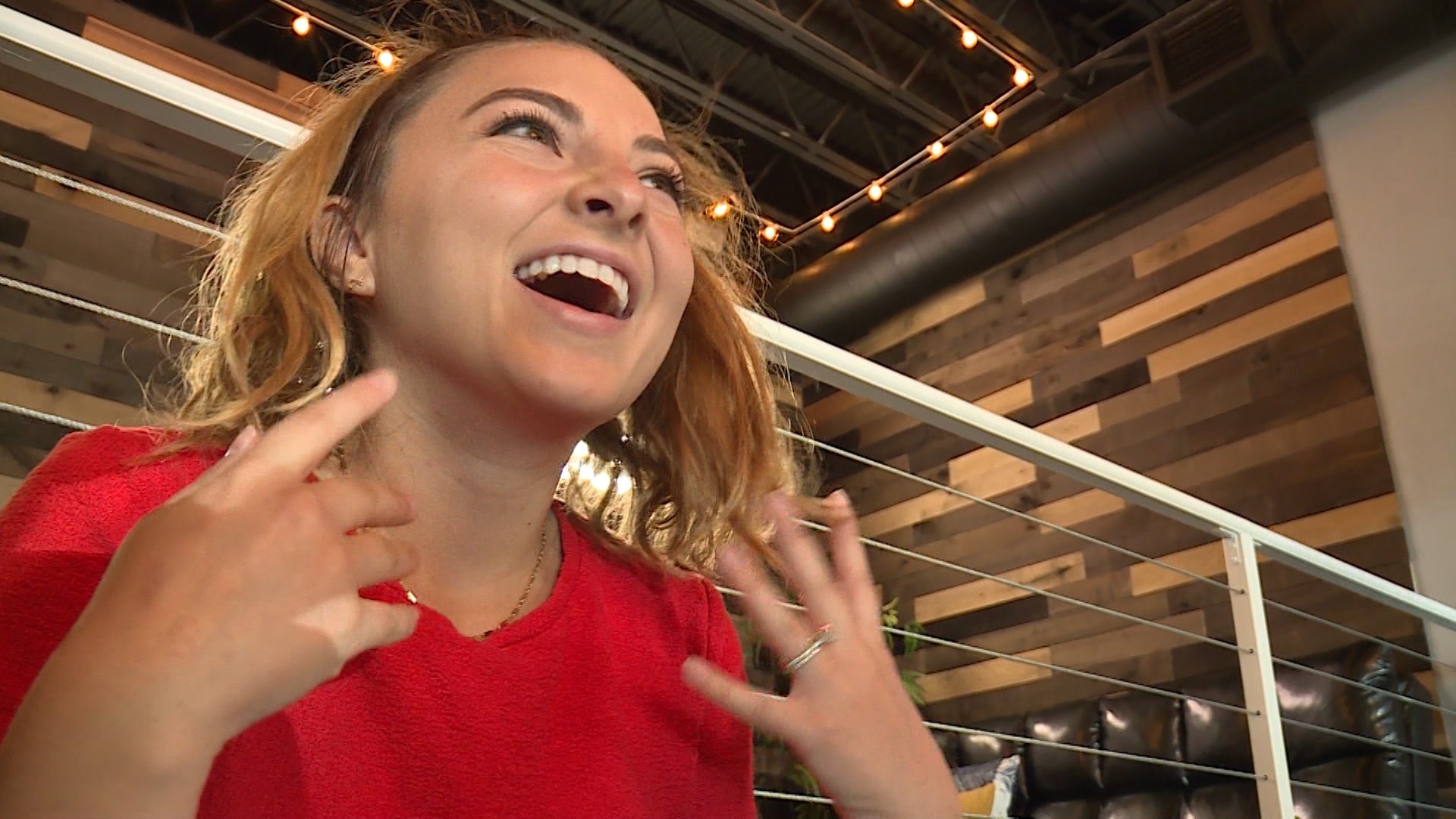 A customer at Fish Kiss Spa reacts to the sensations as the fish start to work on her feet on Tuesday, June 5, 2018. (Photo: Ray Boone, KSL TV)