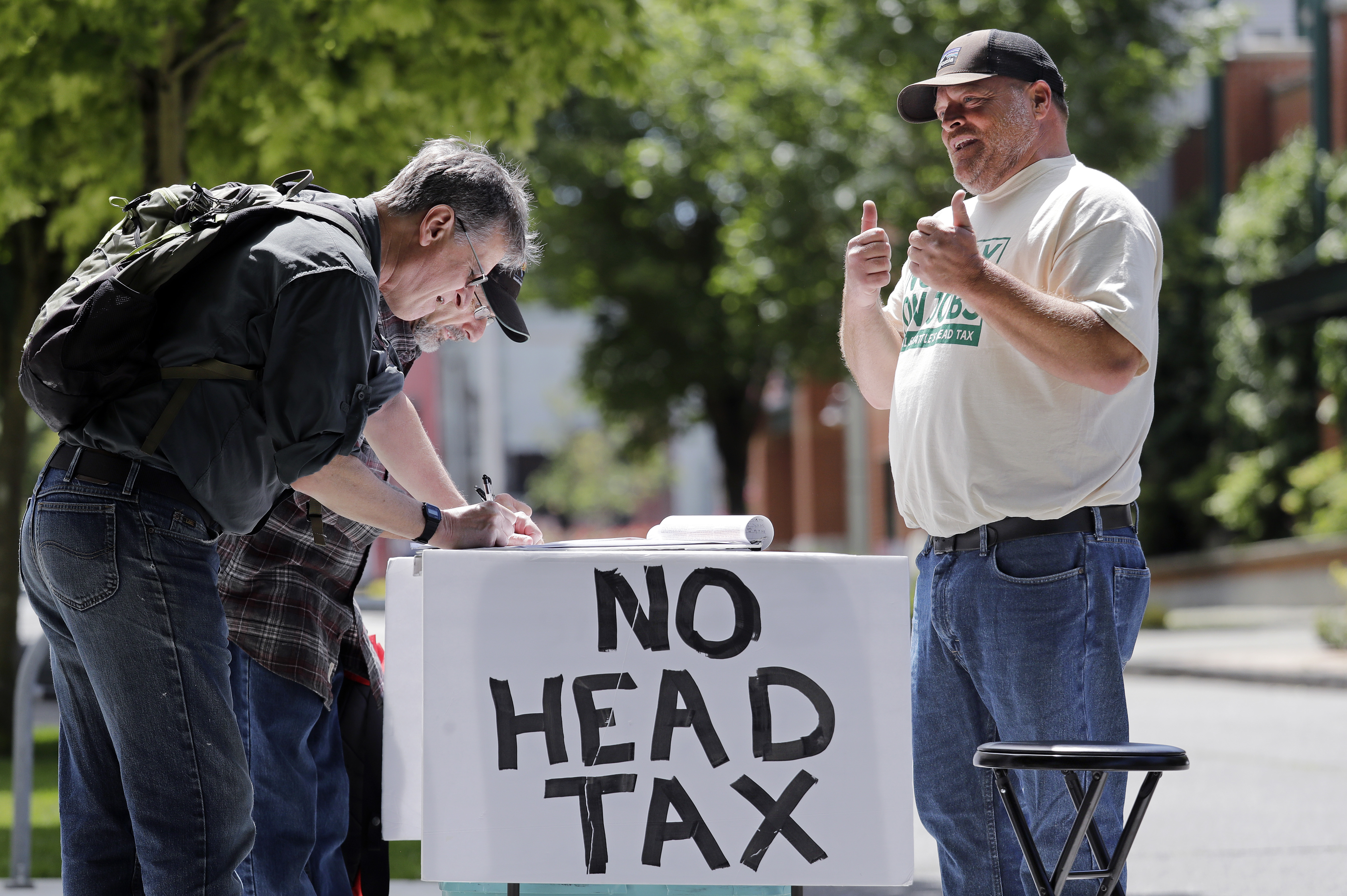 The Latest: Seattle repeals tax on companies like Amazon