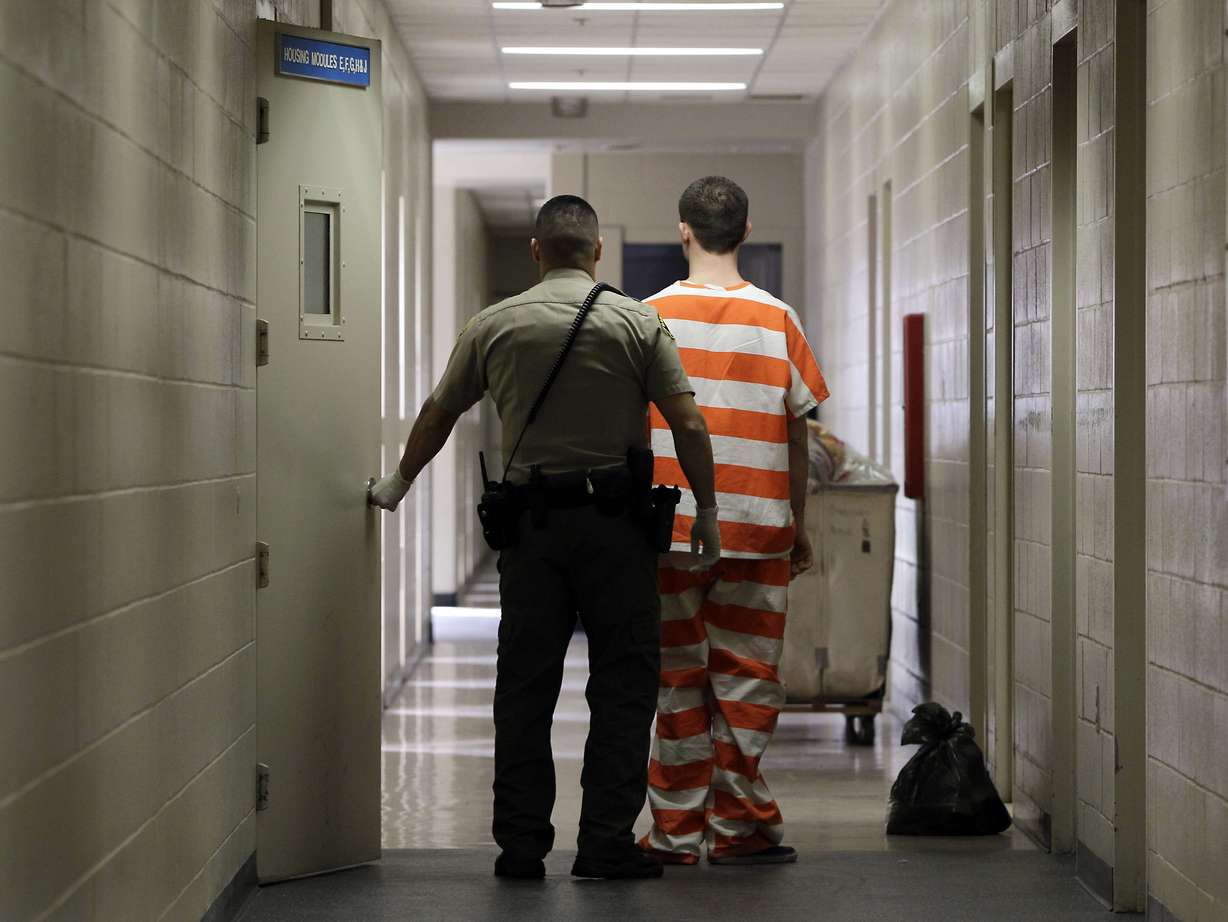 In this Feb. 21, 2013 file photo, an inmate at the Madera County Jail is taken to a housing unit at the facility in Madera, Calif. Photo: Rich Pedroncelli, AP Photo