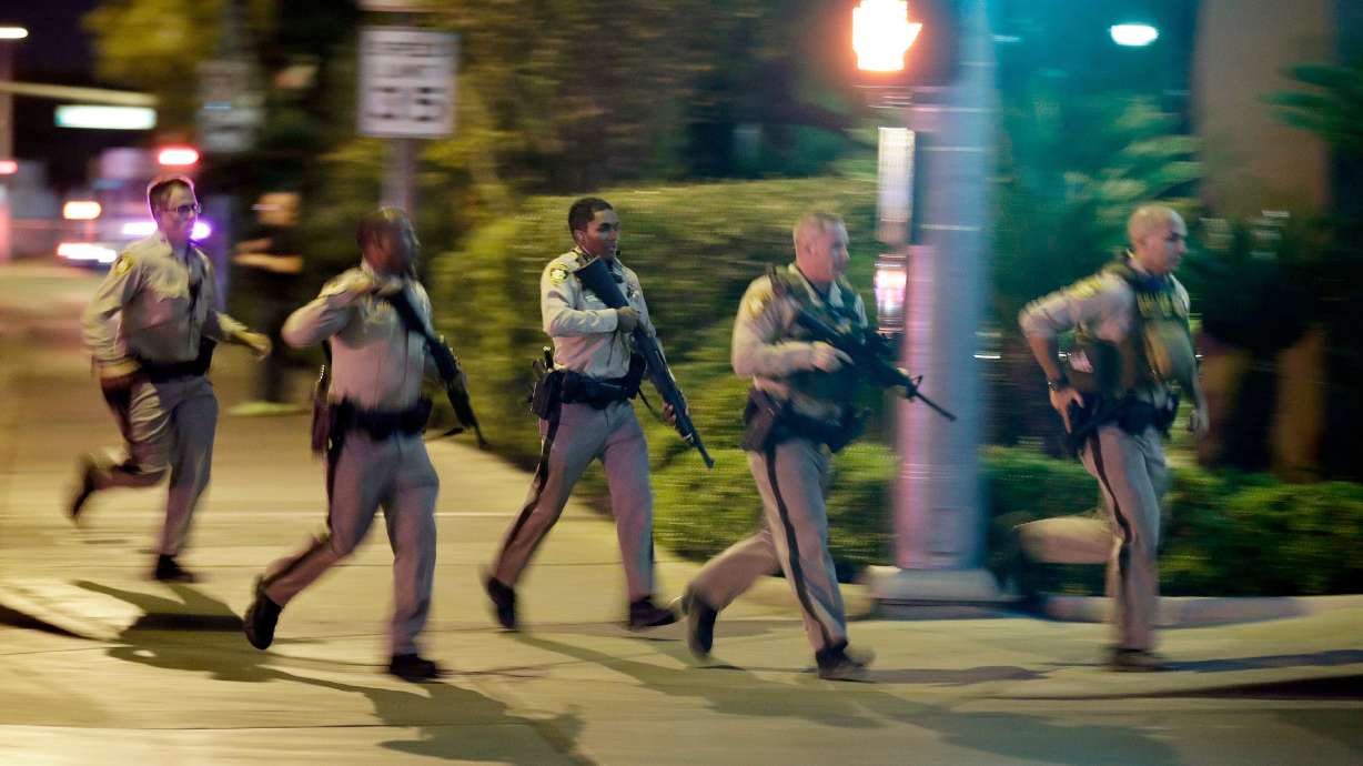 The Latest: Vegas officer video: 'We're in the firing zone'