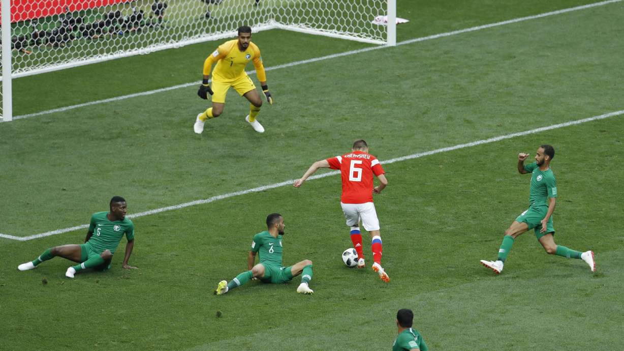 Putin and Russia get their 1st win at the World Cup