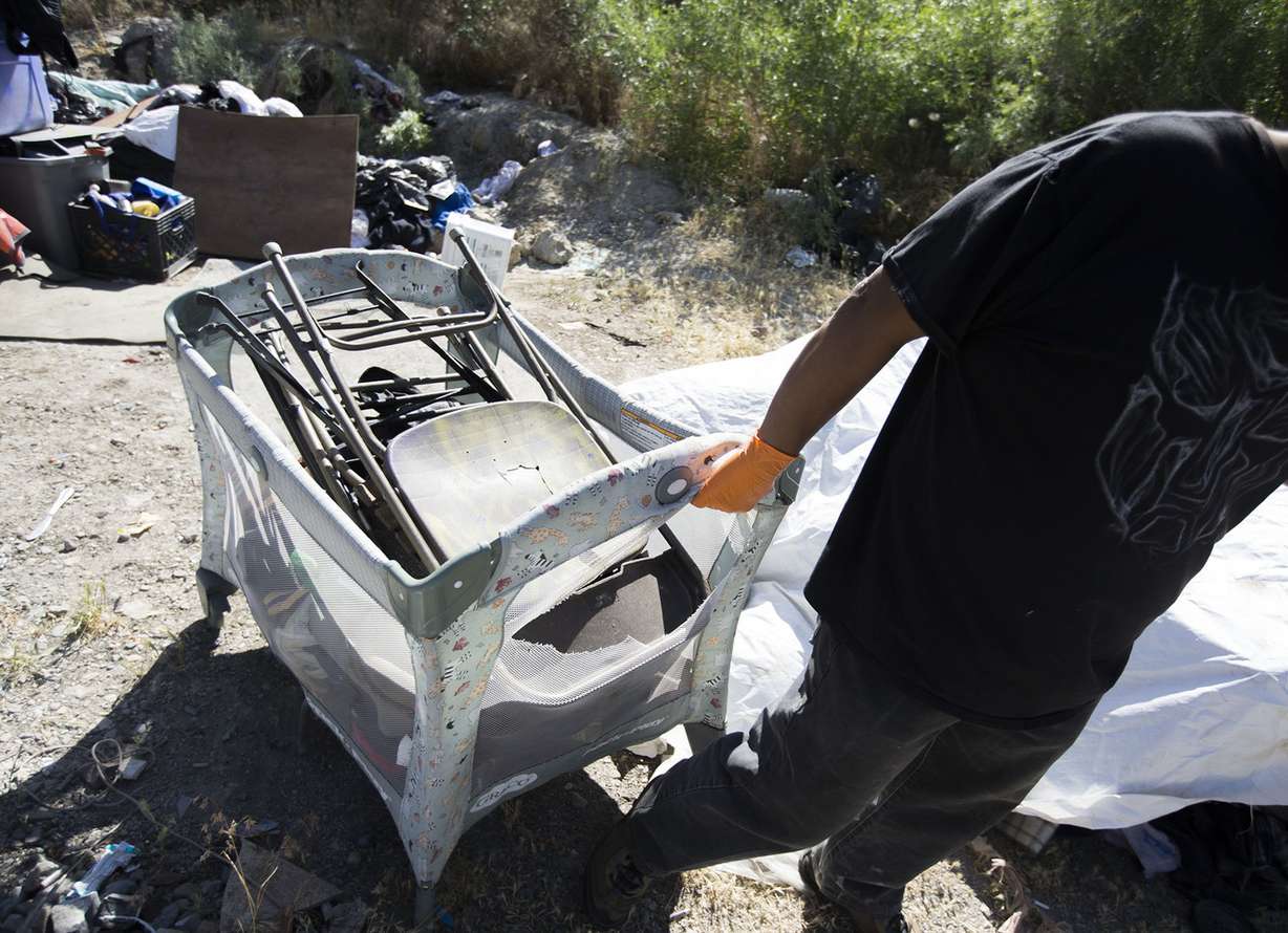 Following reports of illegal camping, excessive litter and human waste, workers with multiple agencies clear out camps located east of Victory Road in the foothills north of Salt Lake City on Thursday, June 14, 2018. (Photo: Laura Seitz, KSL)