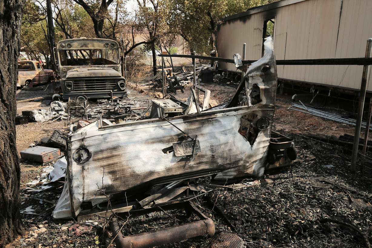Burned-out vehicles are pictured on Thursday, June 14, 2018, in Moab. A fire on Tuesday destroyed several homes. (Photo: Jeffrey D. Allred, KSL)