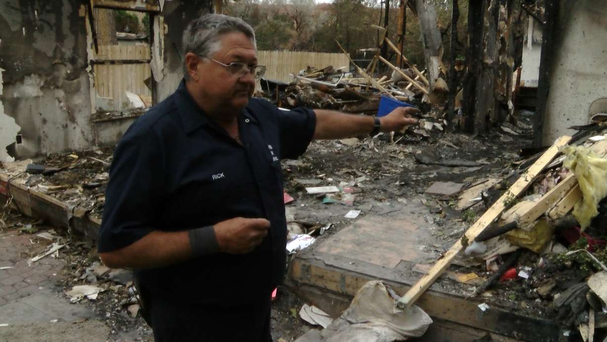 Rick Carrigan wanted to spend his Saturday cleaning up the mess of debris left behind on his Moab property after a wildfire destroyed his home. But the local health department has closed the area due to possible health concerns until a certified asbestos inspector can sign off on allowed people back in. (Photo: Alex Cabrero, KSL TV)