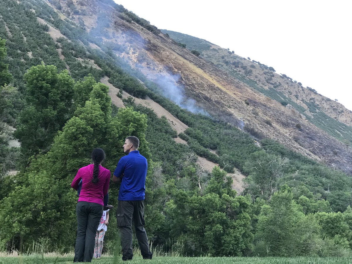 Onlookers watch as helicopters drop fire retardant onto what fire officials are calling the South Fork Fire. The wildfire sparked near Vivian Park in Provo Canyon Saturday afternoon, June 16, 2018, and has burned an estimated 45 to 50 acres. (Photo: Sean Moody, KSL TV)