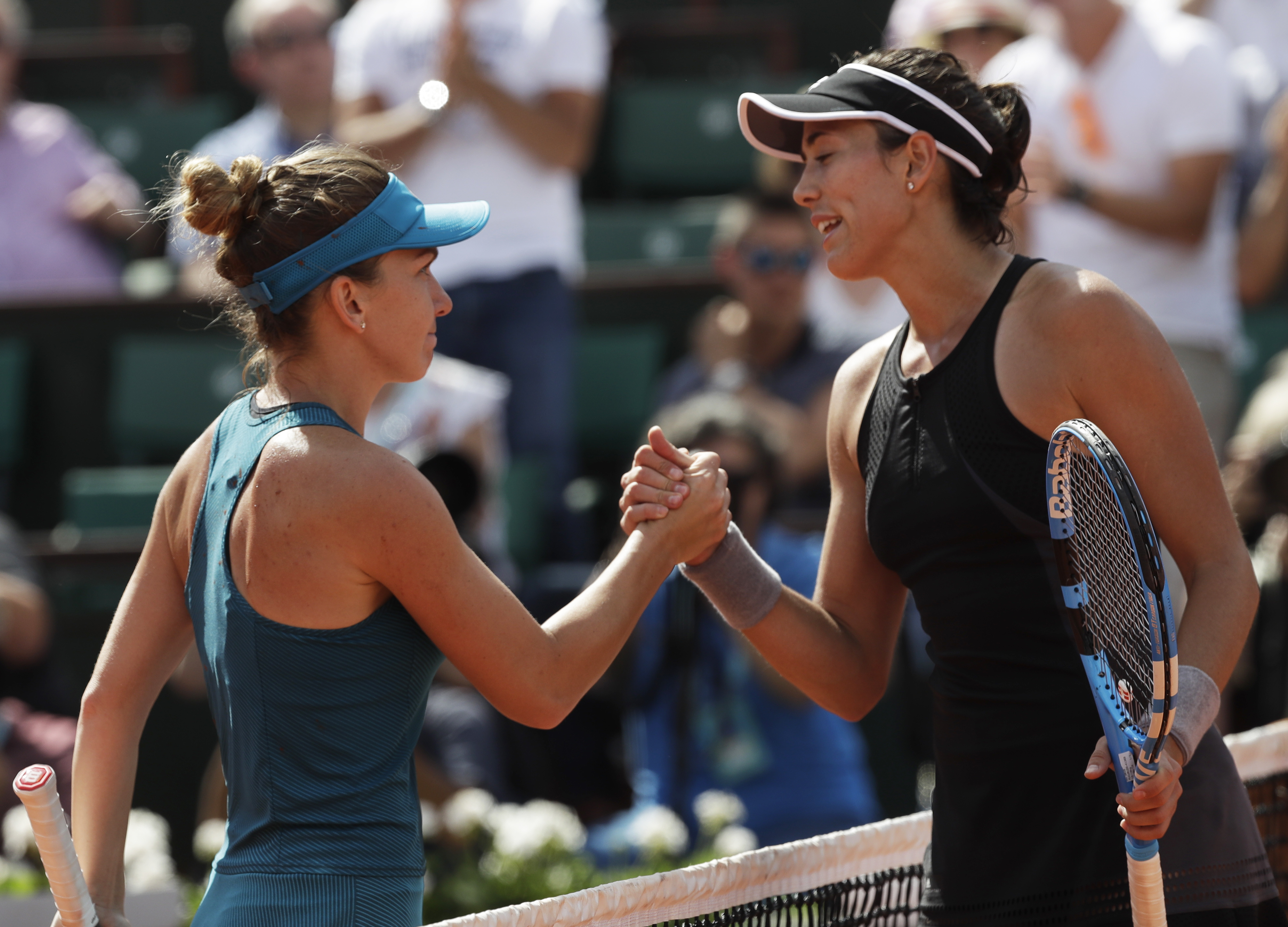 Muguruza gets ready to defend her Wimbledon title