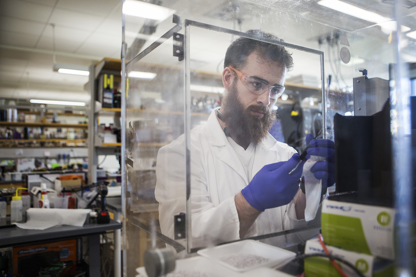 Undergraduate researcher Bailey McFarland prepares a syringe for electrospinning to create yarn made of spider silk nanofibers at Utah State University's Synthetic Spider Silk Lab in Logan on Tuesday, June 5, 2018. Photo: James Wooldridge, KSL