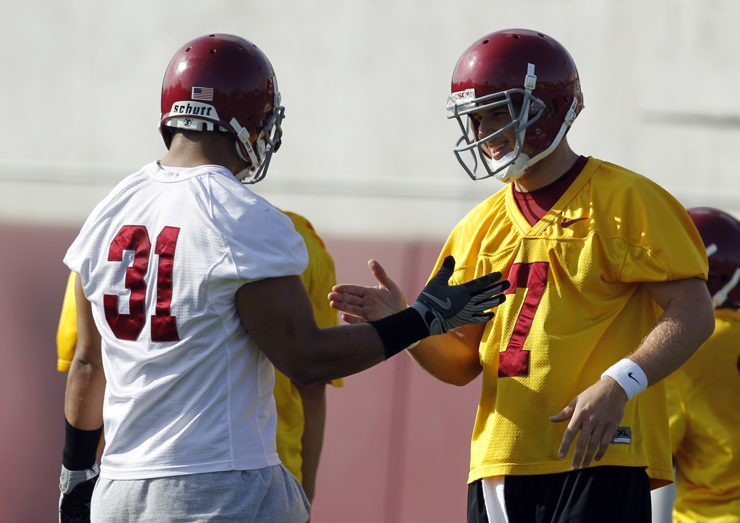 Southern California quarterback Matt Barkley, right, shakes hands with his teammate Stanley Havili during NCAA college football practice in Los Angeles, Tuesday, March 30, 2010. (Photo: Jae C. Hong, AP)