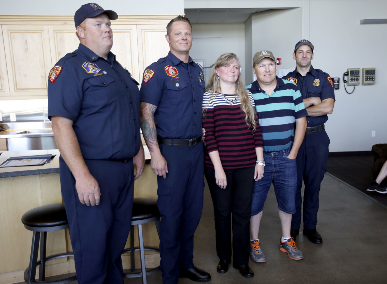 Unified Fire Authority Capt. Joe Egbert, paramedic Josh Bailey, Michelle Patey, Robert Patey and paramedic Brian Winget pose for a photo at fire Station No. 17 in Taylorsville on Monday, June 18, 2018. All had a hand in saving Robert Patey, including wife Michelle Patey, who performed CPR on him for over nine minutes. (Photo: Kristin Murphy, KSL)