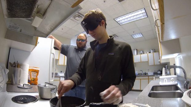 Jim Reed teaches a student with impaired vision how to make mac and cheese by feel, smell and taste. (Photo: KSL TV)