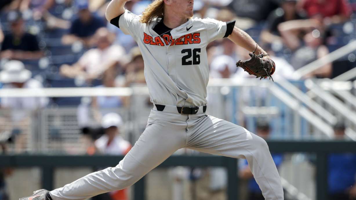 Oregon St. rallies after delay to beat Huskies 14-5 at CWS