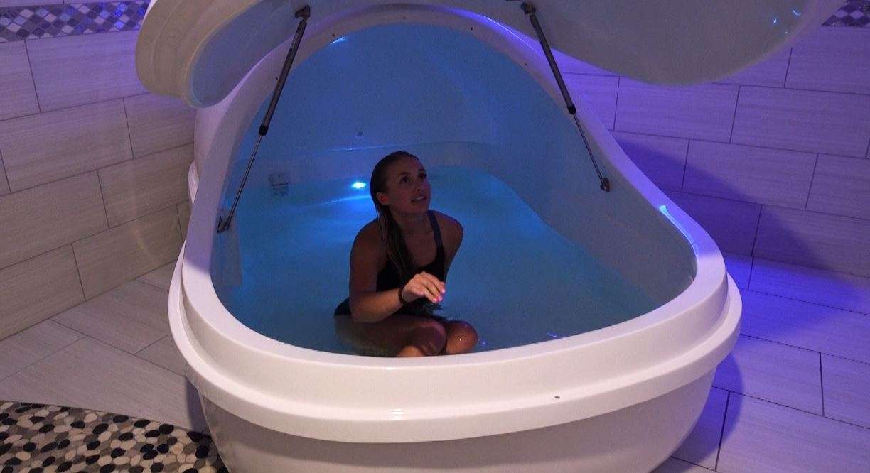Haley Gustavson about to close the lid of her flotation tank before she floats for 60 minutes of uninterrupted meditation. (Photo: KSL TV)