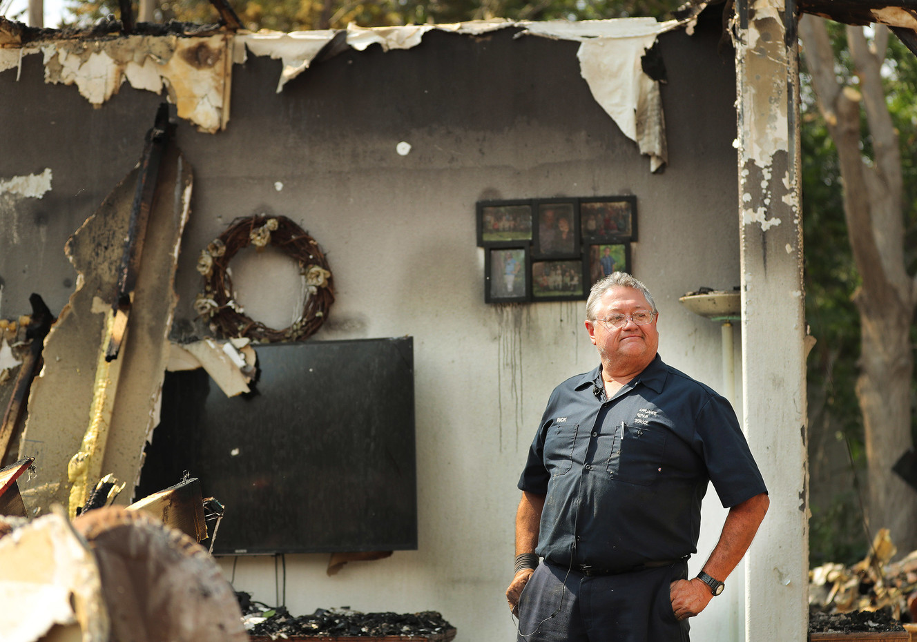 Rick Carrigan looks over the damage to his home on Thursday, June 14, 2018, after a fire on June 12 destroyed several houses in Moab. (Photo: Jeffrey D. Allred, KSL)