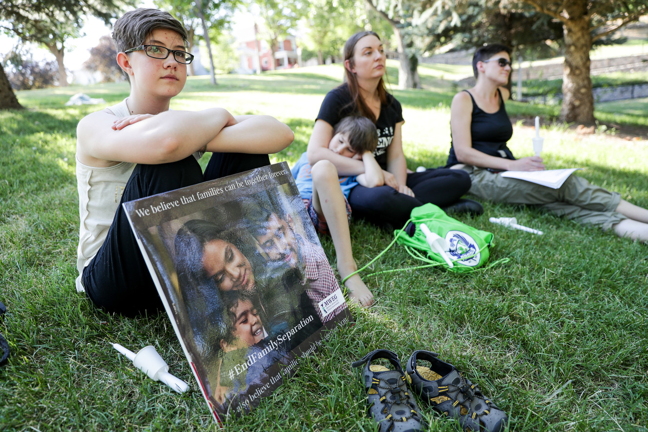 Saoirse Black, 13, of South Jordan, attends a "Keep Families Together Vigil" organized by Mormon Women for Ethical Government at City Creek Park in Salt Lake City on Saturday, June 23, 2018. (Photo: Spenser Heaps, KSL)