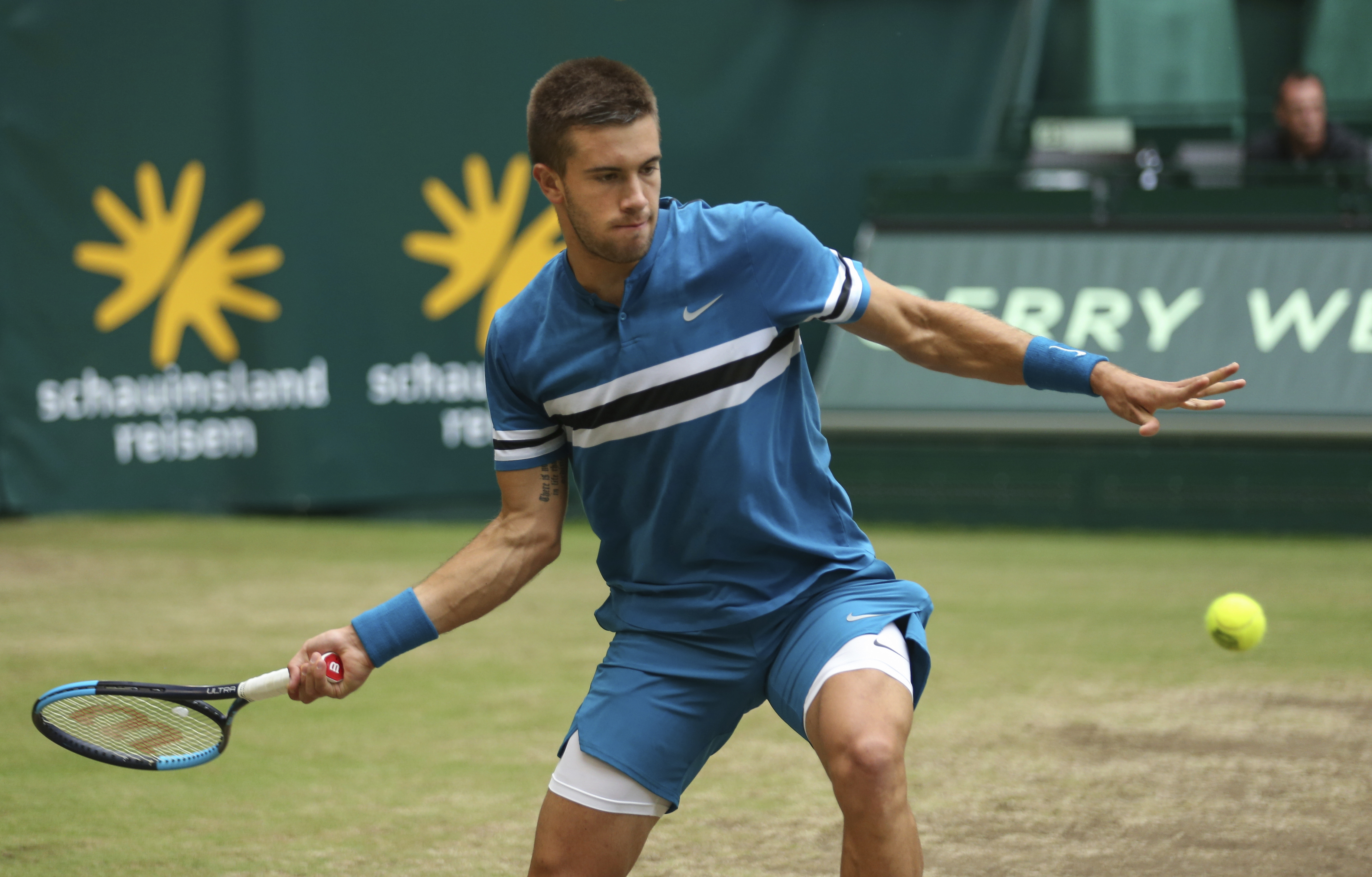Coric ends Federer's winning streak to take Halle title