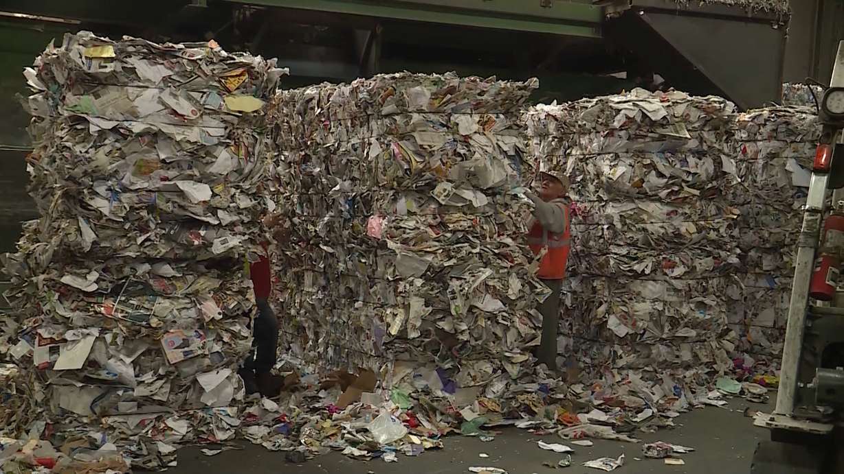 Works go through stacks of items people have recycled at Rocky Mountain Recyclers on Tuesday, June 19, 2018. As a result of changes to the Chinese scrap market, 250,000 customers in the Wasatch Front Waste and Recycling District could lose their curbside recycling service. (Photo: KSL TV)