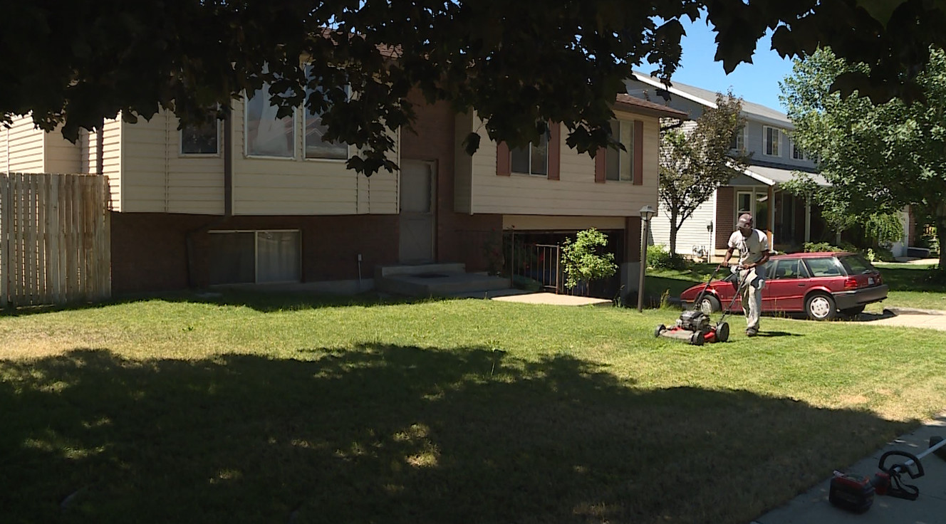 Rodney Smith Jr., of Huntsville, Alabama, mows a lawn in Sandy on Monday, June 25, 2018, as part of his "50 States 50 Lawns," project. He is offering free lawn care for those who are elderly, single mothers, have disabilities or are veterans. (Photo: Sean Estes, KSL)