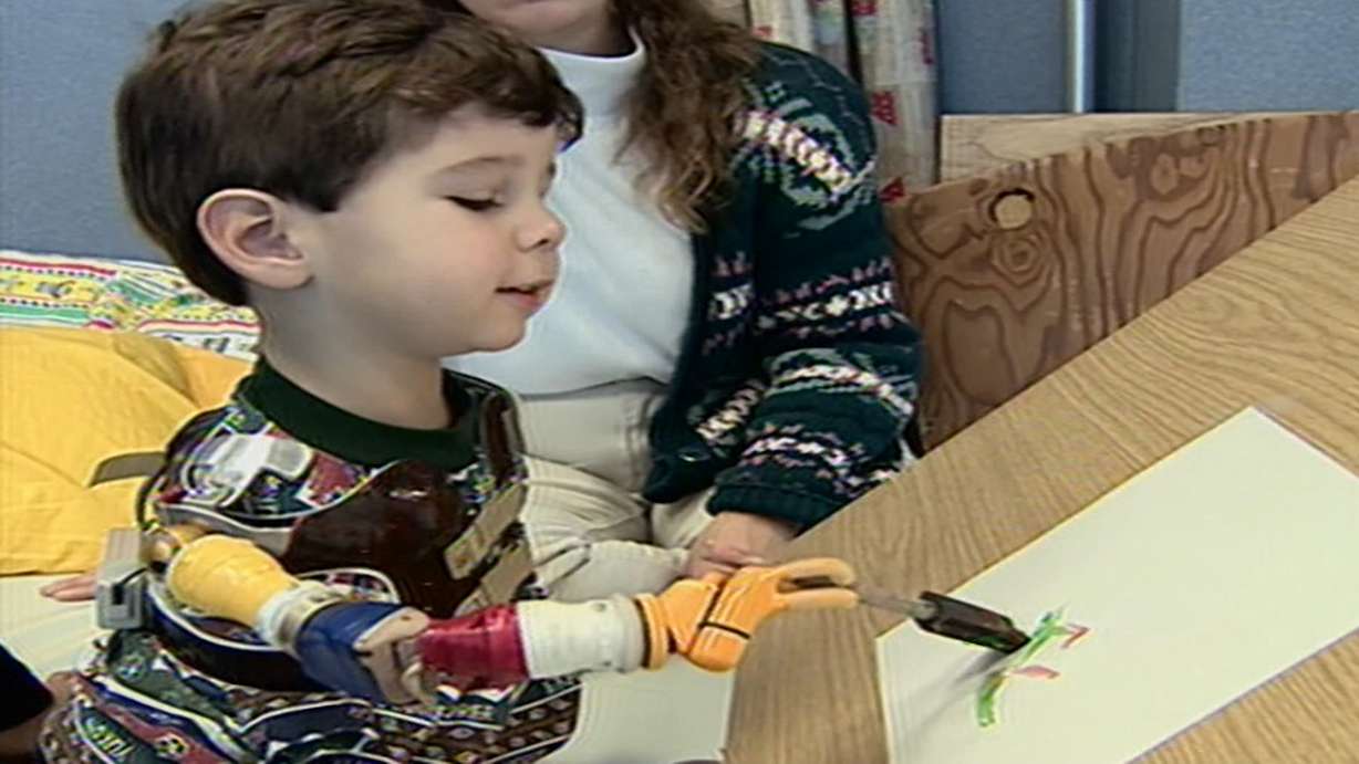 Gideon DiMeglio was born without arms and with feet connected to very short legs. But he didn't let that stop him from becoming an artist at an early age. (Photo: KSL TV, File)
