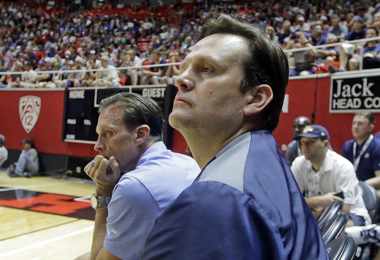 Utah Jazz general manager Dennis Lindsey, foreground, and coach Quin Snyder watch during the second half of the team's NBA summer league basketball game against the Philadelphia 76ers Wednesday, July 5, 2017, in Salt Lake City. (Photo: Rick Bowmer, AP Photo, File)