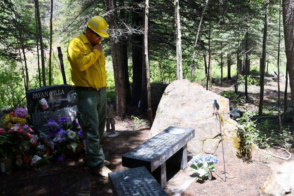 Dustin Jensen visits the headstones of those who died in the Crandall Canyon Mine collapse in 2007, including a memorial for his father who died trying to save the miners. Dustin Jensen worked to preserve the area from the Trail Mountain Fire over the weekend. (Photo: Emery County Sheriff's Office)