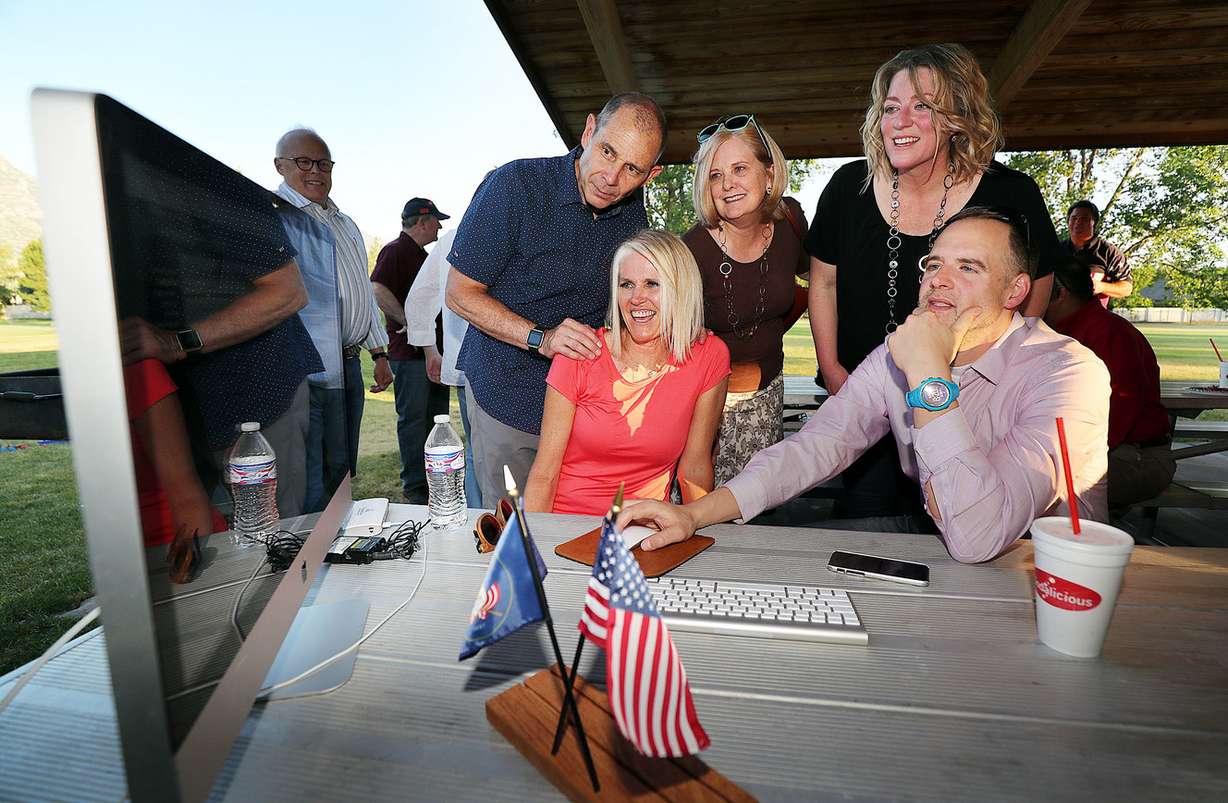 Rep. John Curtis and his wife Sue, center, join with staff as they watch results in Provo on Tuesday, June 26, 2018, for Utah's 3rd congressional district. (Photo: Ravell Call, KSL)