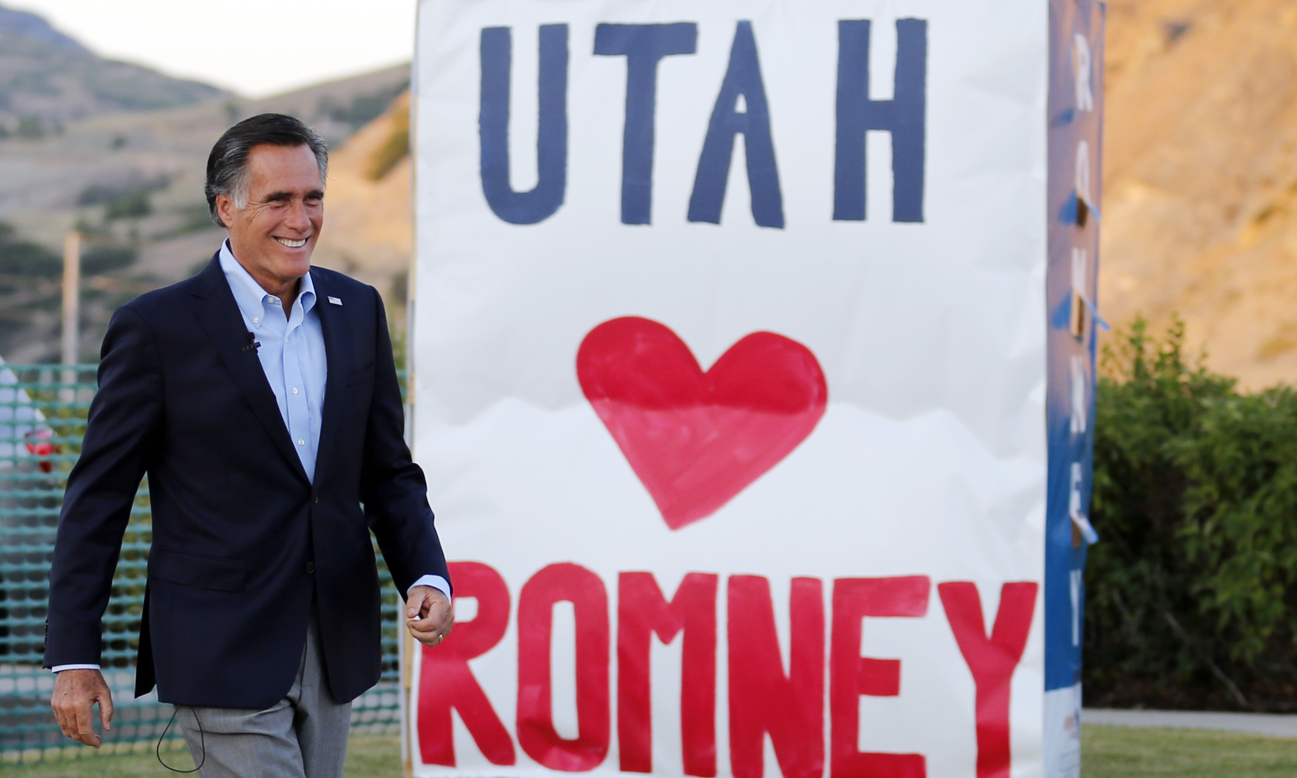 Former GOP presidential nominee Mitt Romney walks to the stage before addressing supporters at campaign headquarters during a primary election night party, Tuesday, June 26, 2018, in Orem, Utah. Romney has won the Republican primary for a Utah Senate seat, setting him on the path to restart his political career with a Senate seat left open by retiring Sen. Orrin Hatch. (AP Photo/Rick Bowmer)