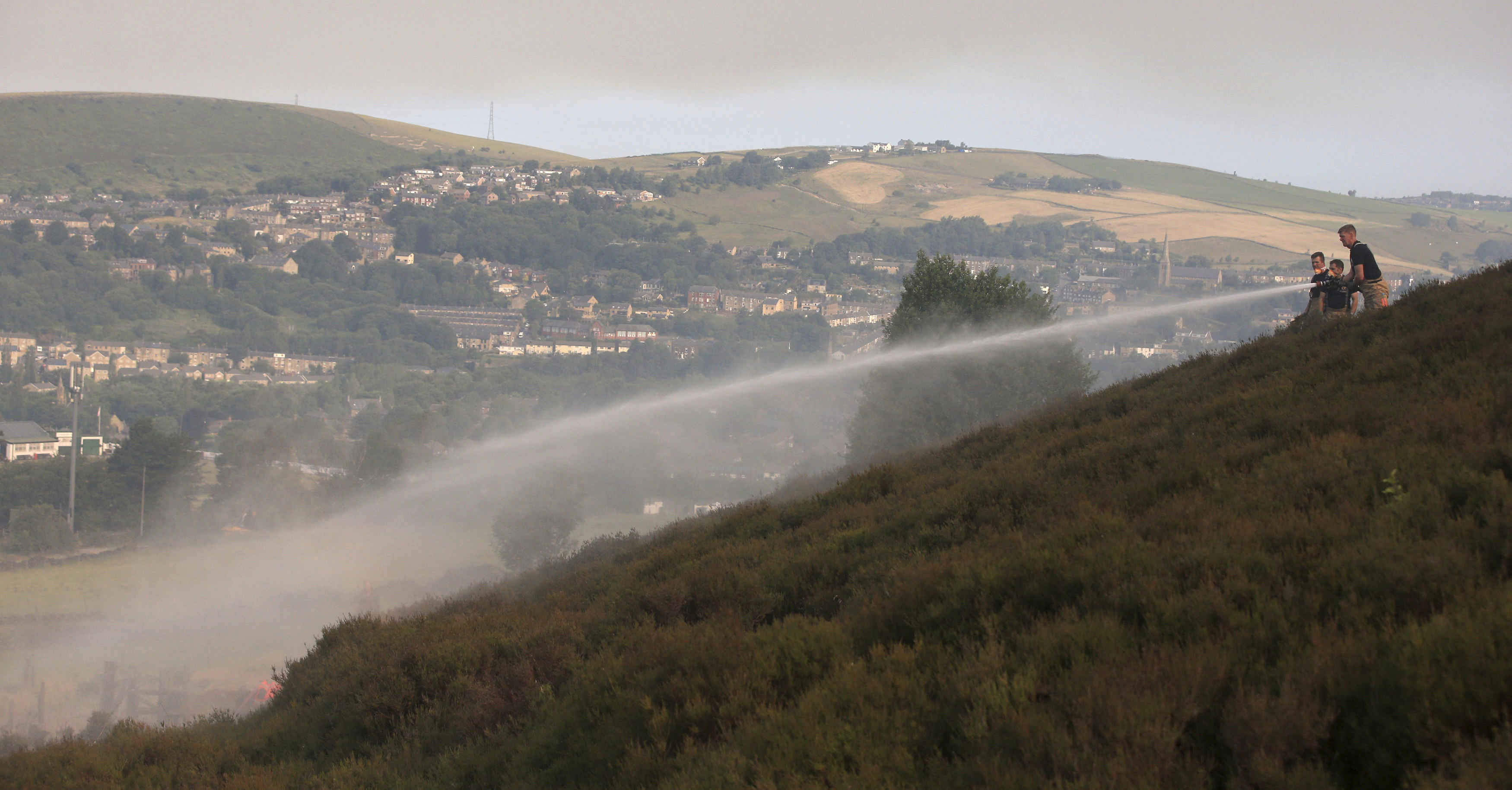 Fire rages across tinder-dry moorland in northwest England
