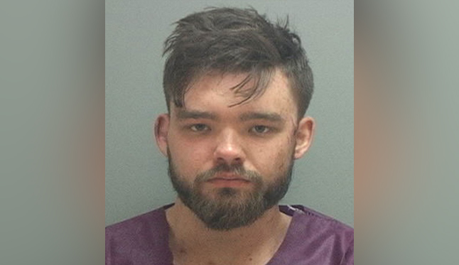 Man charged with murdering 2 in his backyard