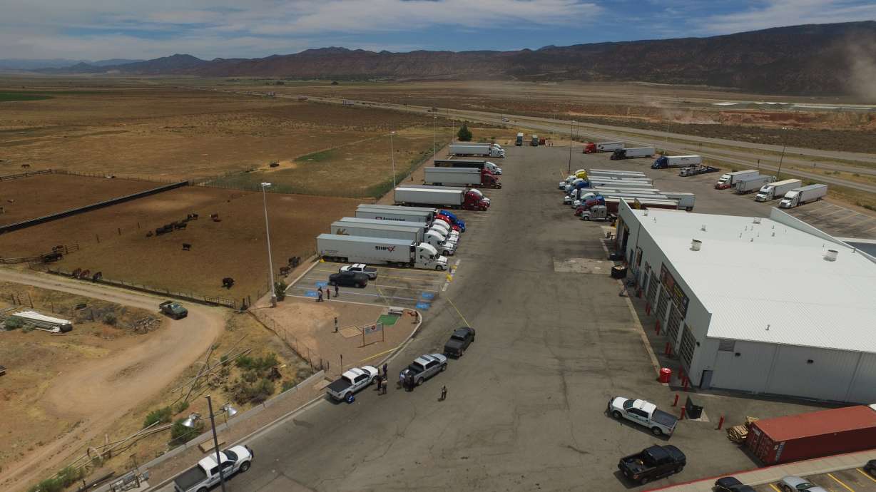 Woman shot by police charged with attacking officer